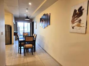 a dining room with a table and chairs at Executive 3 Bedrooms Apartment In Bahria Town in Rawalpindi