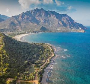 an aerial view of a beach with a mountain at Fabia's House in Tertenìa