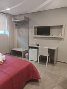 A bed or beds in a room at Hotel Valle Verde