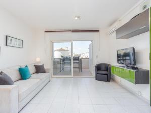 A television and/or entertainment centre at Apartment Sant Maurici-25 by Interhome Még 15 kép