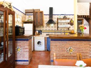 a kitchen with a washer and dryer at Holiday Home Rincón del Sur by Interhome in Nigüelas