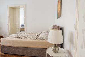 Postel nebo postele na pokoji v ubytování Vienna City Apartments Unteres Belvedere