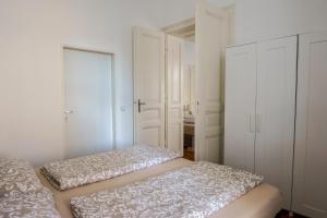 Postel nebo postele na pokoji v ubytování Vienna City Apartments Unteres Belvedere