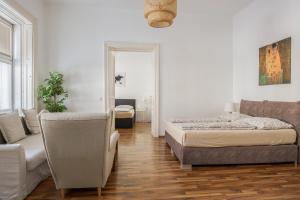 Postel nebo postele na pokoji v ubytování Vienna City Apartments Unteres Belvedere