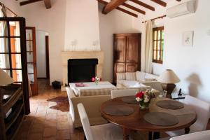 a living room with a table and a couch at Villa Golf Azur in Saint-Raphaël