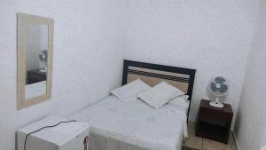 Cama ou camas em um quarto em Pousada Aquarela