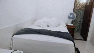 Cama ou camas em um quarto em Pousada Aquarela