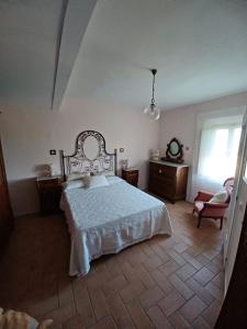 Кровать или кровати в номере Casa Vacanze L'Acquerello