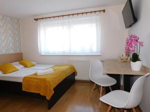 Łóżko lub łóżka w pokoju w obiekcie Family Homes - Dom Wakacyjny EDA