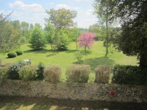 a view of a garden with hay bales at Le Manoir "Aux Douves" in Bazoges-en-Paillers +38 photos