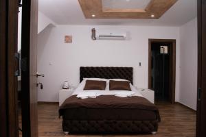 Rúm í herbergi á Sobe i Apartmani Casa Mia