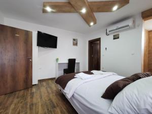 Rúm í herbergi á Sobe i Apartmani Casa Mia
