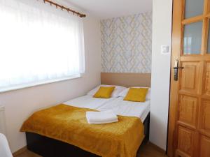 Łóżko lub łóżka w pokoju w obiekcie Family Homes - Dom Wakacyjny EDA