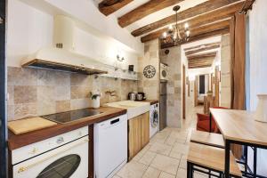 a kitchen with a sink and a counter top at CMG - Notre Dame de Paris in Paris