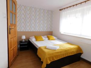 Łóżko lub łóżka w pokoju w obiekcie Family Homes - Dom Wakacyjny EDA