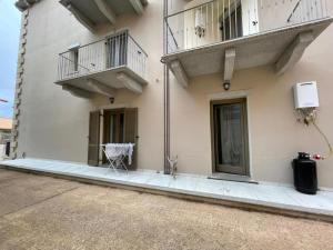 a building with two balconies on the side of it at Casa Manzoni in La Maddalena