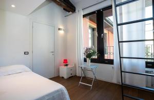 Un pat sau paturi într-o cameră la Residenza Casa dell'Architetto