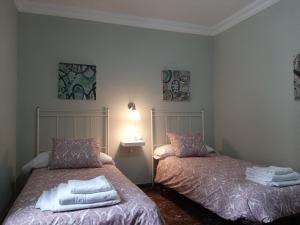 Łóżko lub łóżka w pokoju w obiekcie Vivienda Rural Maestro Herrador