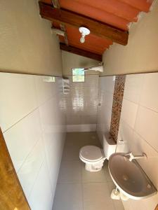 a bathroom with a toilet and a sink at Recanto Bela Vista Costa Dourada-BA in Costa Dourada
