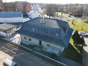 an overhead view of a house with a green roof at Elbe Villa Magdeburg in Magdeburg