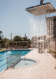 The swimming pool at or close to Dominoes Corfu