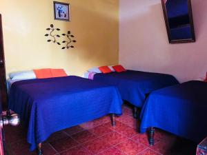 Postel nebo postele na pokoji v ubytování Hotel Marjenny