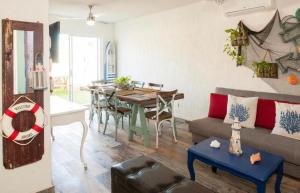 a living room with a couch and a table at Marineros Vallarta in Puerto Vallarta