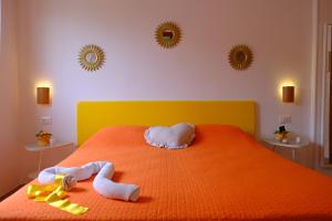 A bed or beds in a room at B&B Il Giardino Stellato