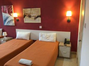 Ένα ή περισσότερα κρεβάτια σε δωμάτιο στο Whitestar Guesthouse