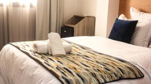 Postel nebo postele na pokoji v ubytování Hotel SunSet Beni Mellal