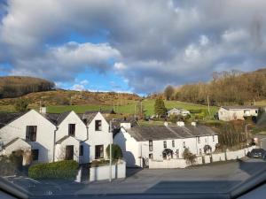 a group of white houses in a small village at The Annexe in Ulverston