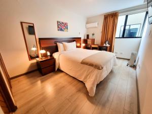 Postel nebo postele na pokoji v ubytování Hotel Las Palmas + 27 fotografií