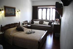 Postel nebo postele na pokoji v ubytování Hotel Petrino