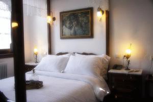 Postel nebo postele na pokoji v ubytování Hotel Petrino