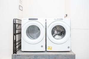 two washing machines are sitting next to each other at Falke Inn in Anchorage