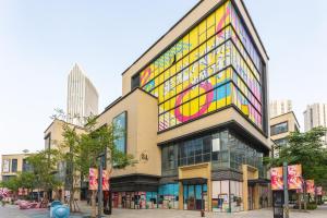 a building with a lot of colorful windows at Locals Apartment House 17 in Jiang'an