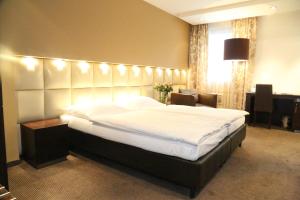 Łóżko lub łóżka w pokoju w obiekcie Prielmayerhof HOTEL