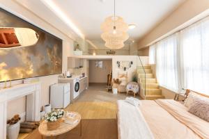 a large living room with a couch and a fireplace at Locals Apartment Inn 16 in Jiang'an