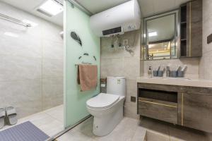 a bathroom with a toilet and a sink at Locals Apartment Inn 21 in Han-yang-hsien +36 photos