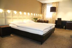 Łóżko lub łóżka w pokoju w obiekcie Prielmayerhof HOTEL