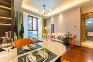 a living room with a table and a couch at Locals Apartment Place 25 in Hankou +19 photos