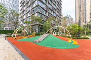 a playground in the middle of a city at Locals Apartment Place 25 in Hankou