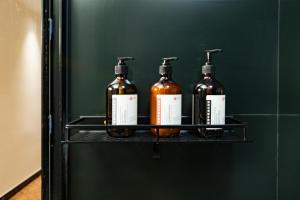 four bottles of alcohol on a shelf in a refrigerator at Locals Apartment House 42 in Changsha