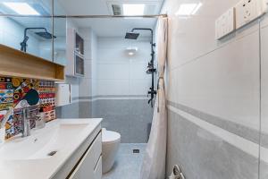 a bathroom with a sink and a toilet at Locals Apartment Place 99 in Hangzhou +26 photos
