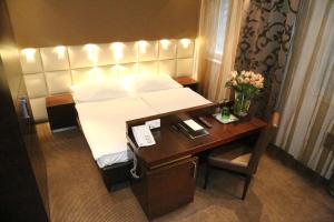 Łóżko lub łóżka w pokoju w obiekcie Prielmayerhof HOTEL