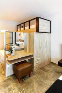 Postel nebo postele na pokoji v ubytování Graha Socio Hotel Nusa Dua Bali