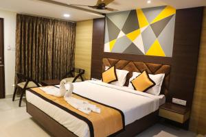 a bedroom with a bed with swans on it at Honey Hive in Port Blair