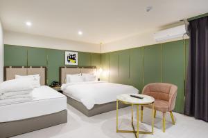 Postelja oz. postelje v sobi nastanitve Brown-Dot Hotel Minam