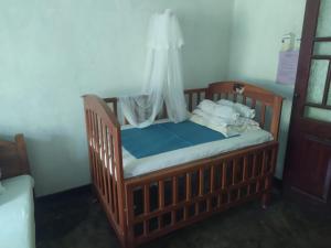 Postel nebo postele na pokoji v ubytování Weeragiri home stay
