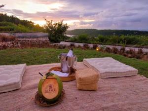 a table with two mattresses and a blender on it at MAUA Nusa Penida Bali in Nusa Penida
